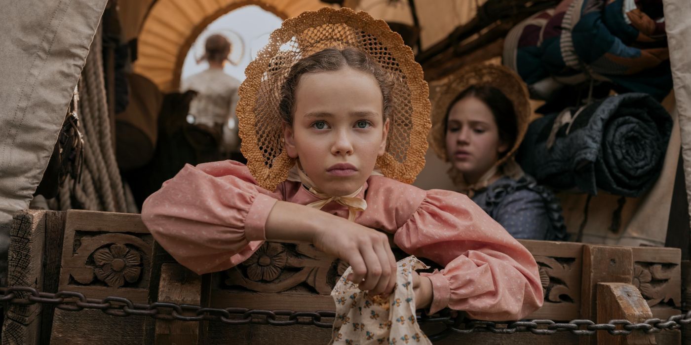 A girl in a wagon in 'Little House on the Prairie'