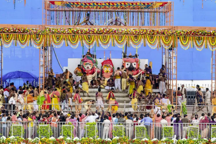 Devotees perform the preparatory rituals of Lord Jagannath, Lord Balabhadra and Goddess Subhadra during the Snana Purnima festival, in Puri