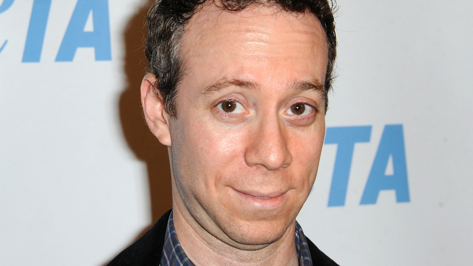 Kevin Sussman with his eyebrows raised