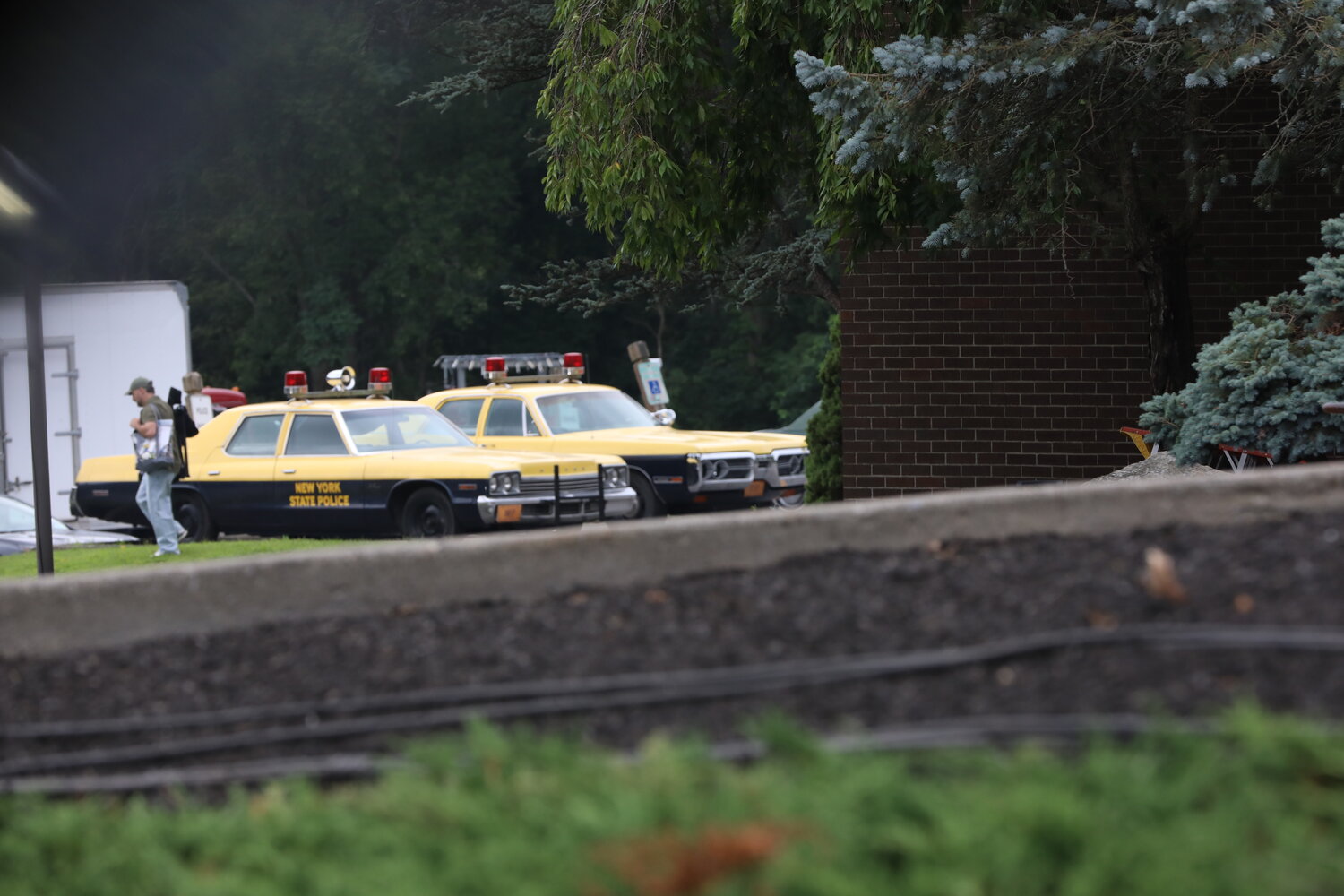 Vintage 1970s-era cars filled the parking lot at Carmel Town Hall during the filming of an episode for the upcoming Netflix series "God of the Woods."