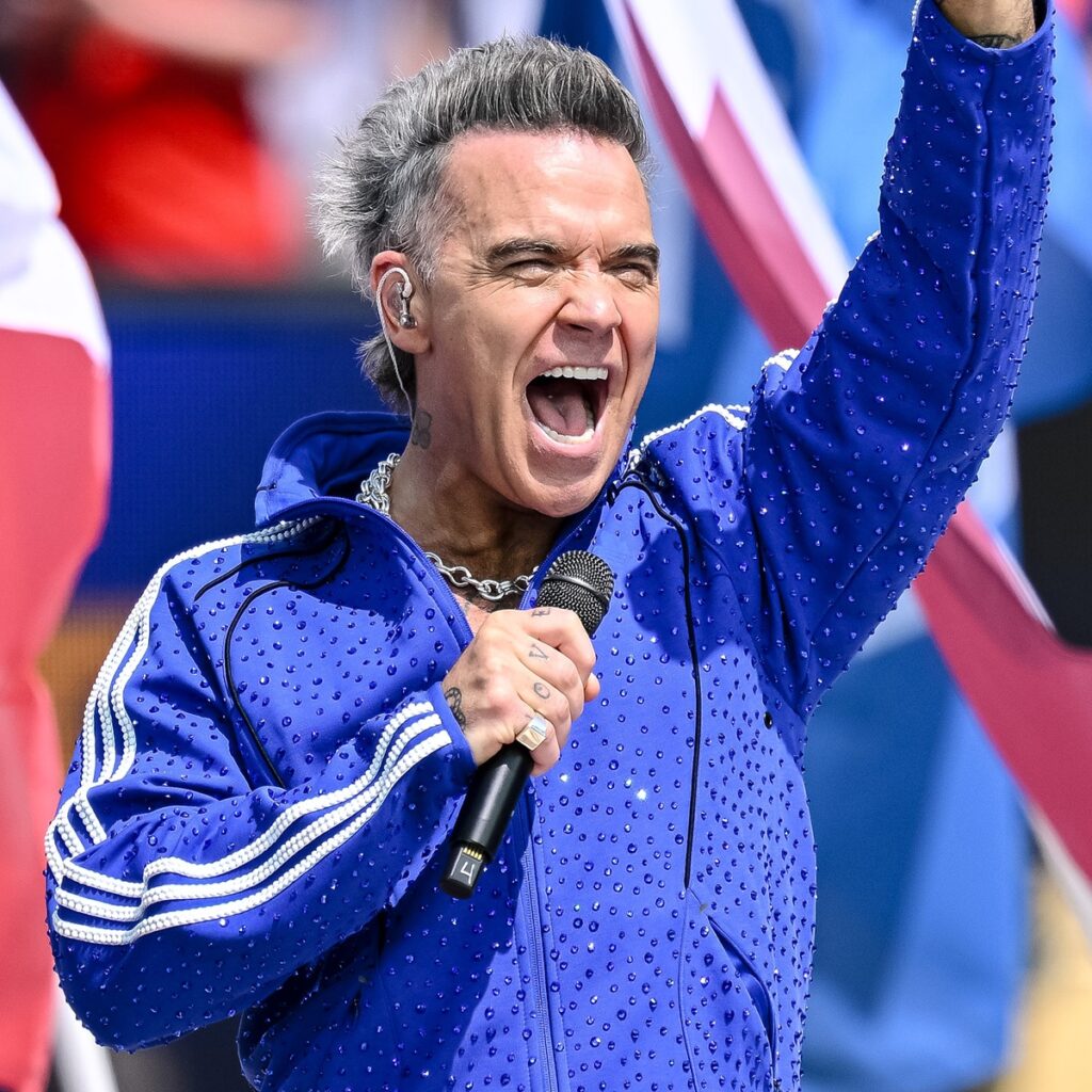 Robbie Williams Speaks Out After White Substance Falls on Mic During World Cup Broadcast