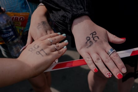 Fans show their queue numbers ahead of Harry Styles’ concert.