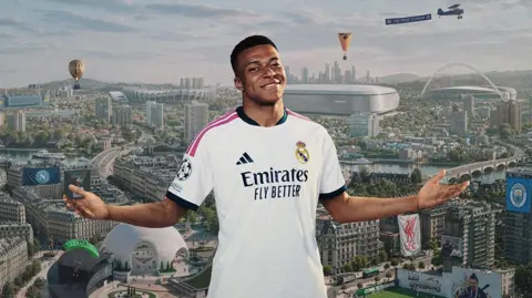 EA Kylian Mbappé is pictured wearing his Real Madrid strip, smiling, in front of a cityscape backdrop featuring dozens of references to different football teams and players. Flags for Manchester City and Liverpool and a mural depicting Zlatan Ibrahimovich are among the immediately obivious references..