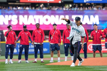 USA coach Mauricio Pochettino throws out the ceremonial first pitch before a game between the Blue Jays and Mariners in Seattle.