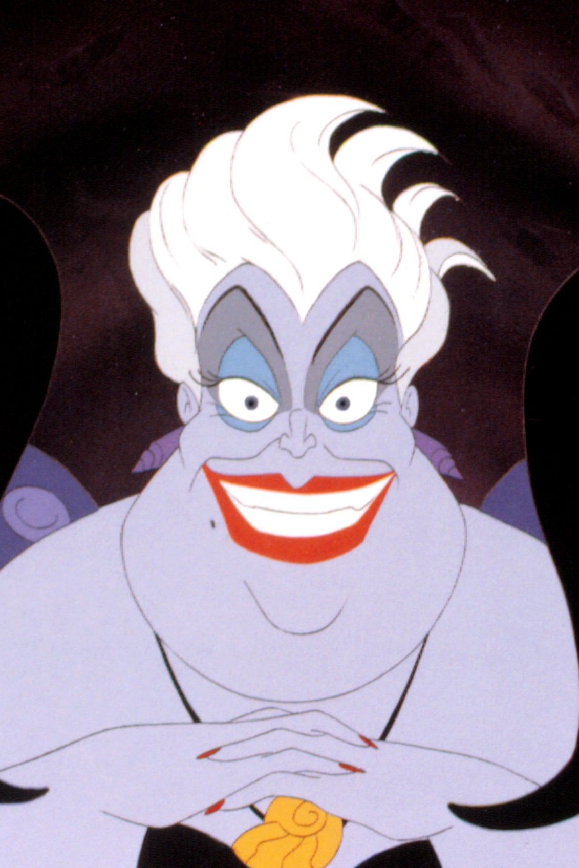 Animated sea witch character, Ursula, with white hair, red lips, and tentacles in a sinister pose from a classic film