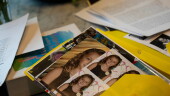 Kate goes through folders of writings and photographs from her time at Unita Academy and other residential programs in her apartment in Kentucky, Wednesday, Dec. 10, 2025. (AP Photo/Michael Swensen)