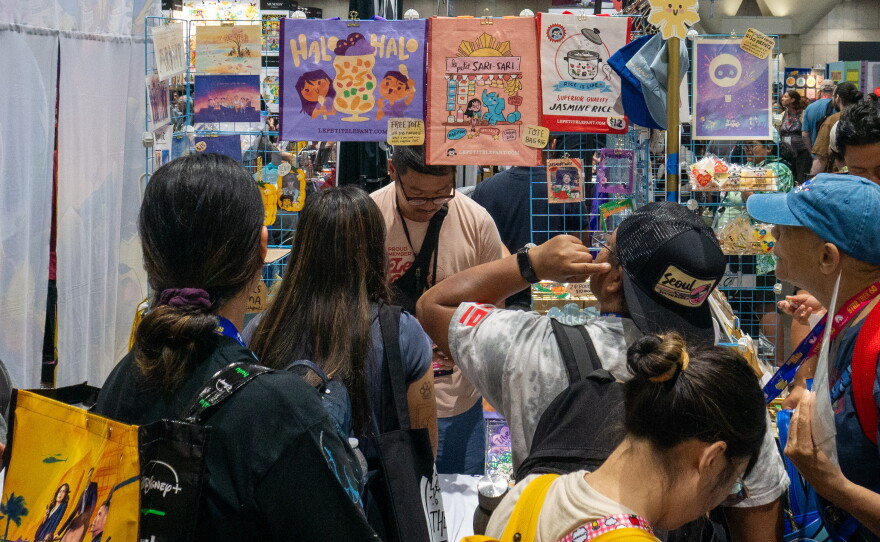 Comic-Con attendees wait in line for the Le Petit Elefant booth in the Small Press section on July 23, 2026.