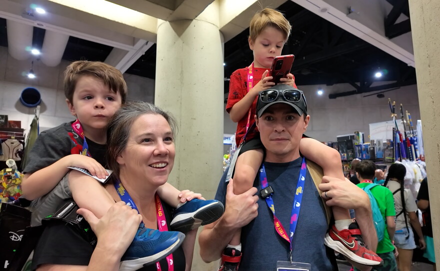 Jennifer and Jeremy Cullen with their two sons on the convention floor at Comic-Con International, July 24, 2026. They are attending the massive pop-culture convention for the first time.