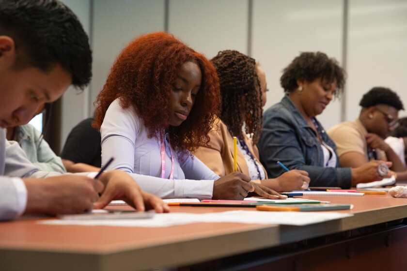 Rai-Elle Ingram works on her superhero "Ultra Rain" during Edgardo Miranda-Rodriguez's workshop at the Obama Presidential Center.