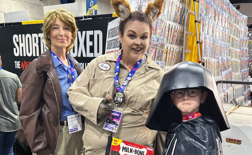 Family members cosplay as characters from "Spaceballs": Elizabeth Stromberg as Lone Starr, Renee Stromberg Thielman as Barf and Elara Thielman as Dark Helmet during Comic-Con on July 24, 2026.