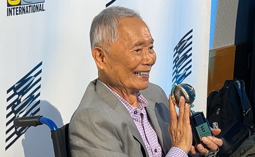 George Takei poses with his Eisner Award for Best Graphic Memoir for "It Rhymes with Takei" during Comic-Con on July 24, 2026.