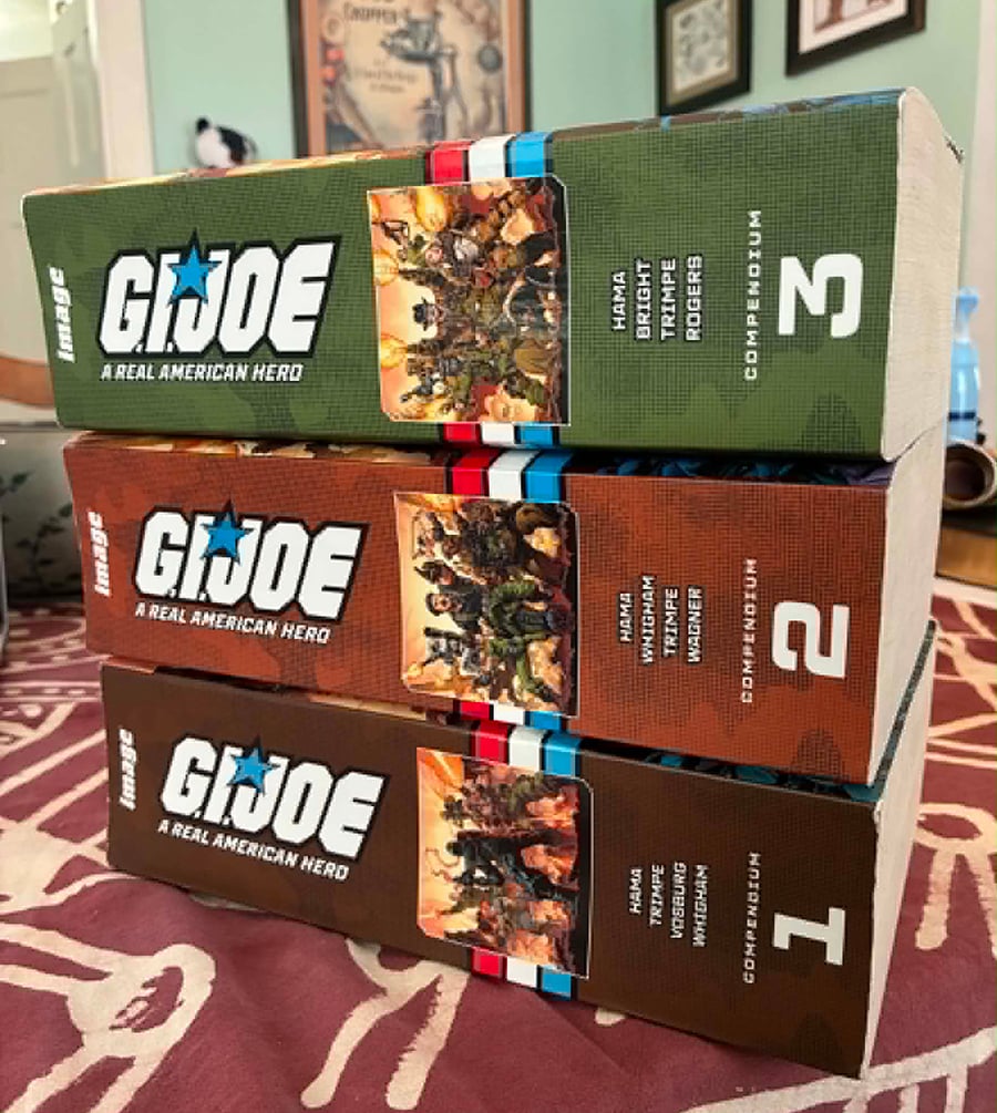 The three GI Joe Compendiums stacked up on my table. They're very thick!