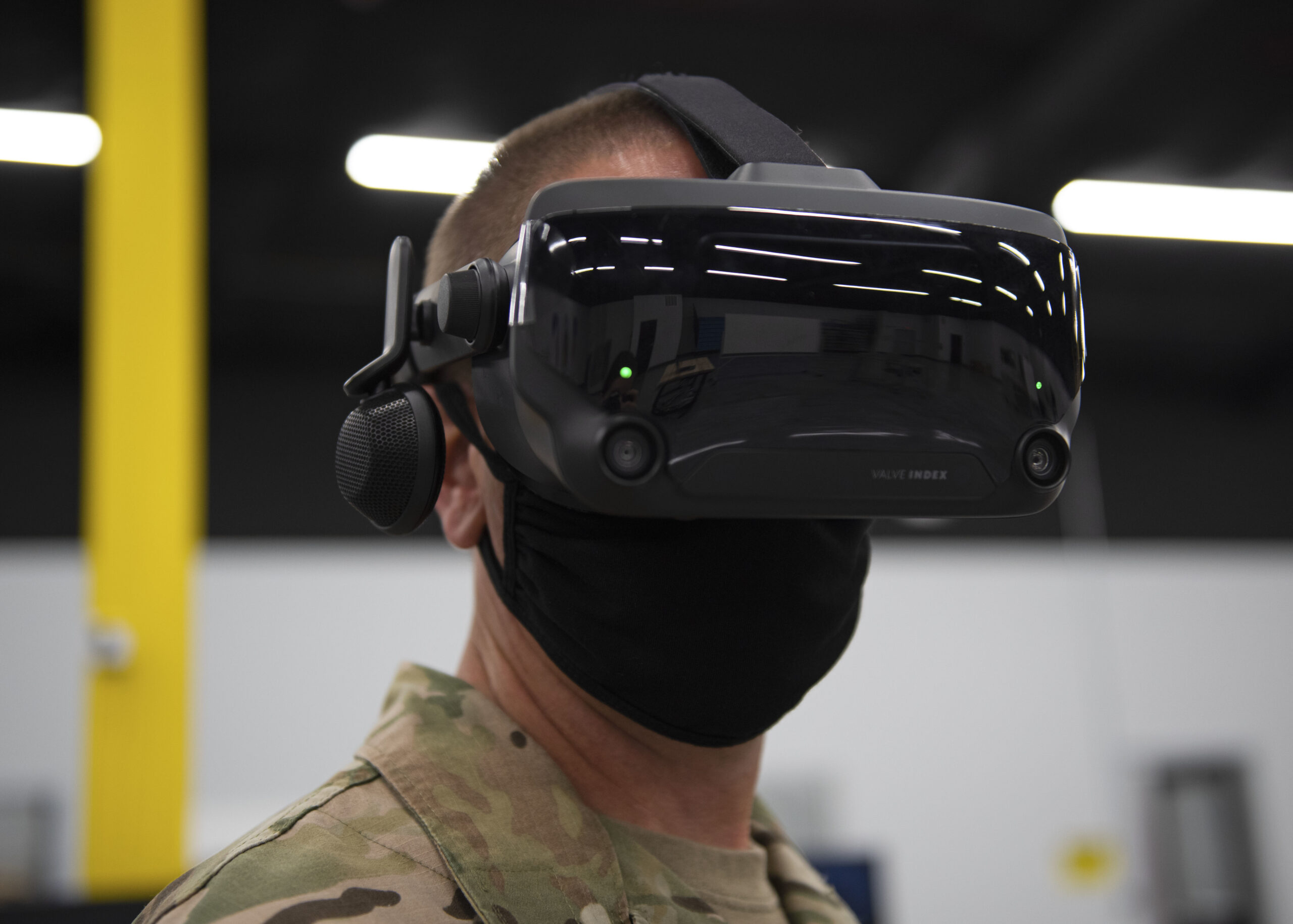 Valve Index VR headset in use with knuckle controllers