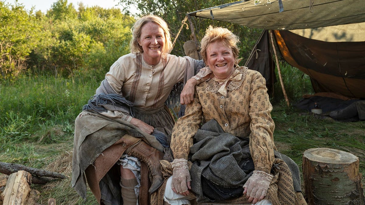 Alison Arngrim as Ida stands with Andrea Greening in a scene from Little House on the Prairie.