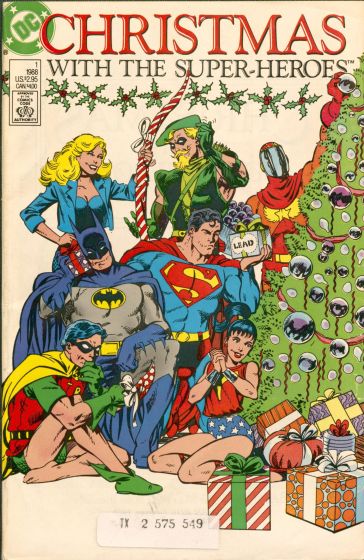 Superman, Batman and other superheroes sit next to a Christmas tree.
