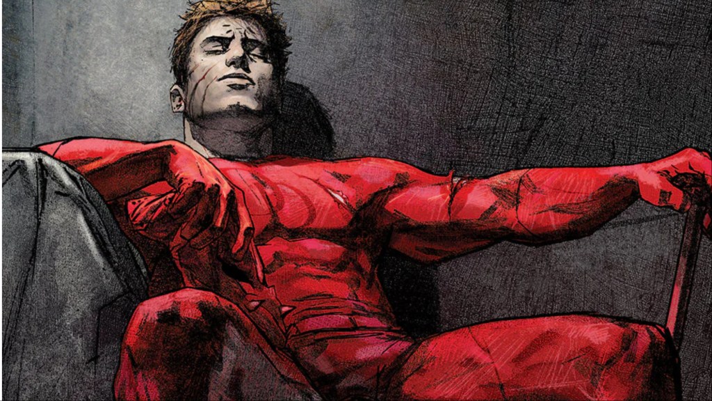 Daredevil with his mask off, sitting on a throne-like chair