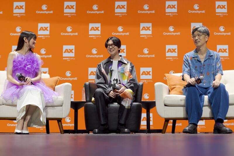 Voice actors speaking at a panel