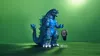 The photo shows a Godzilla figurine at SDCC