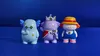 The photo shows three character figurines at SDCC