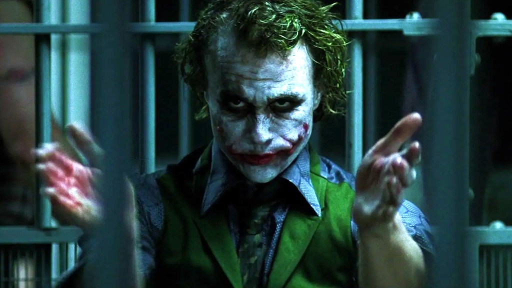 The Joker clapping in jail cell in The Dark Knight