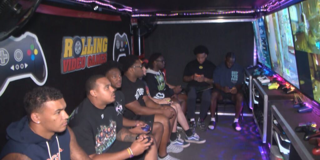 Virginia football players connect with fans through video games