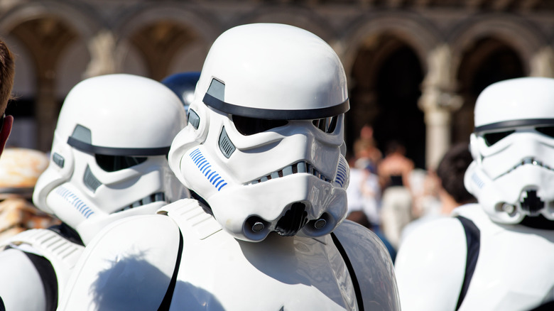 People outdoors wearing iconic Star Wars Stormtrooper outfits