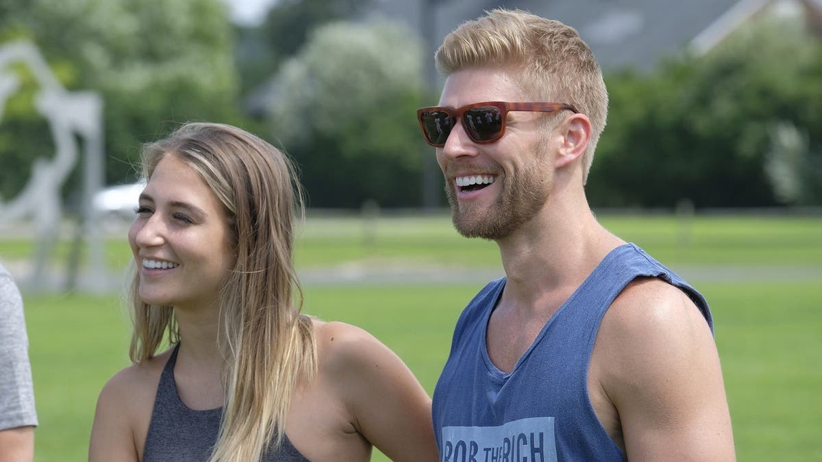 Amanda Batula and Kyle Cooke stand together on Summer House.