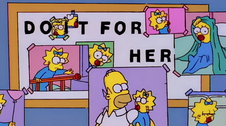 Homer holds Maggie in a photograph in "And Maggie Makes Three"
