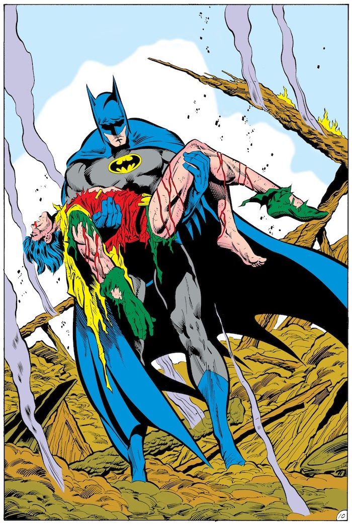 A splash page from Batman #428 showing a sorrowful Batman holding Jason's lifeless, bloody body, his costume in tatters.