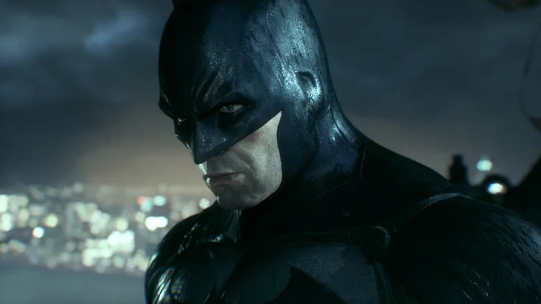 Batman stands looking downcast in Batman: Arkham Knight