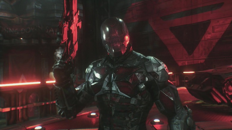 Red Hood drawing his gun in Batman: Arkham Knight