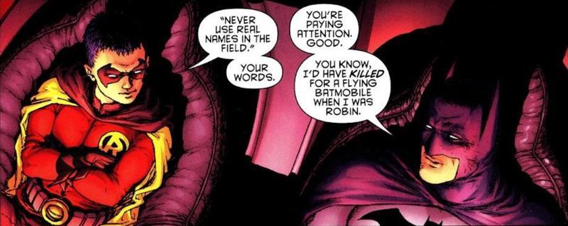 Panel from Batman and Robin showing Dick Grayson and Damian Wayne sitting in the Batmobile.