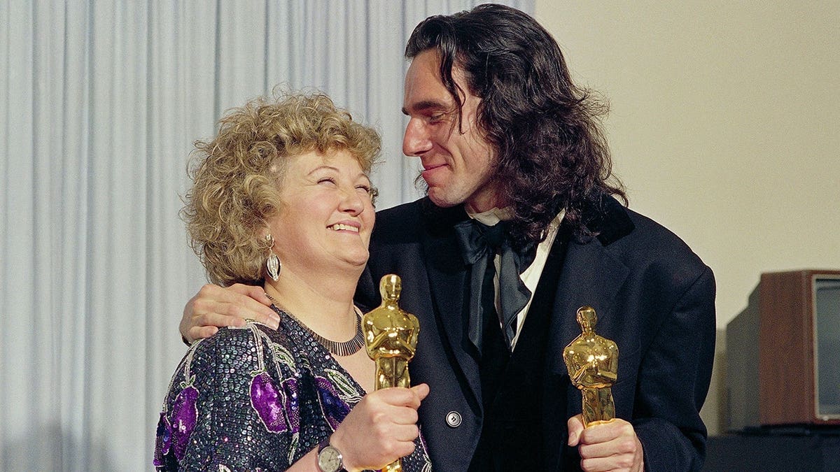 Brenda Fricker and Daniel Day-Lewis stand together at the Academy Awards in Los Angeles.