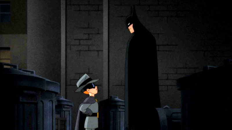 Batman standing in a shadowy alleyway with Carrie Kelley.