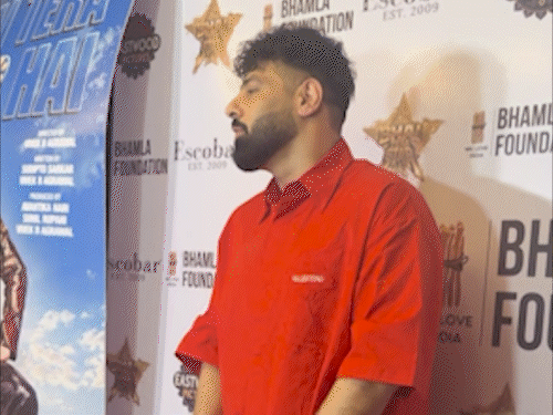 Rapper-singer Badshah appeared in a casual look in a red T-shirt and black pants.
