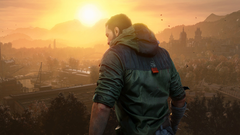 Kyle Crane surveys a factory at sunset in "Dying Light: The Beast" (2025)