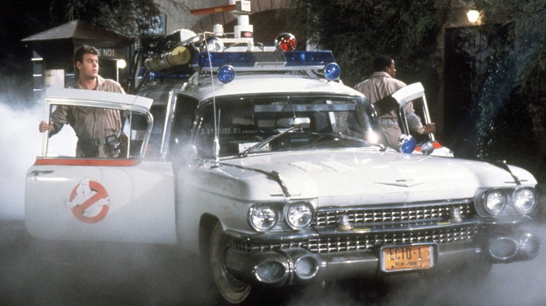 Winston and Ray exiting Ecto-1 in "Ghostbusters"