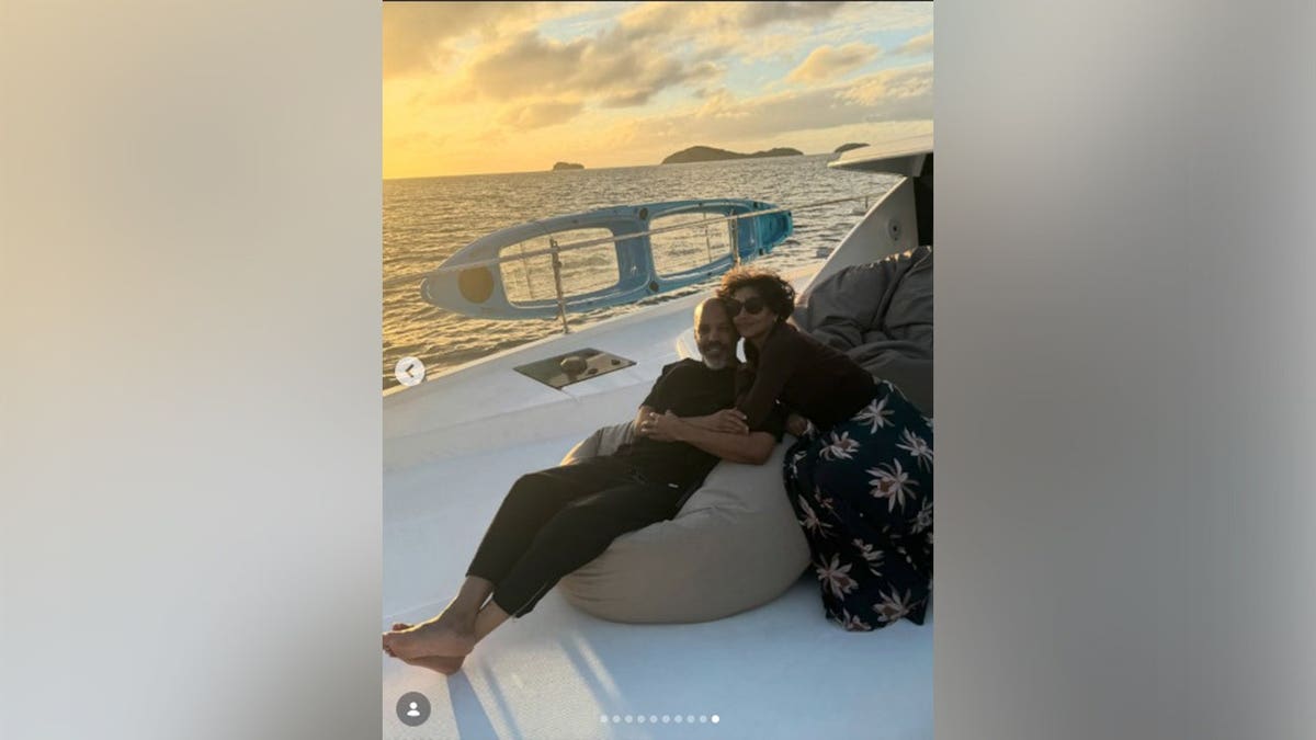 Halle Berry and Van Hunt cuddling while on a yacht on vacation.