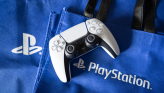 PS5 controller on a PlayStation-branded tote bag