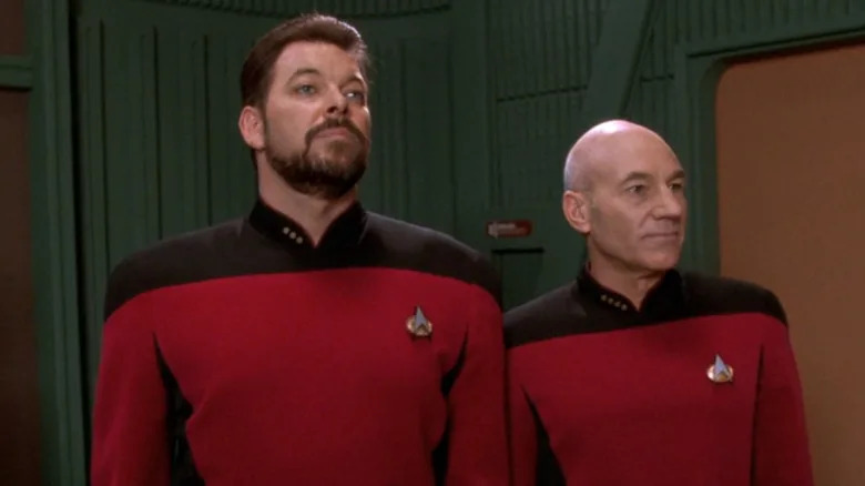 Riker and Picard looking on