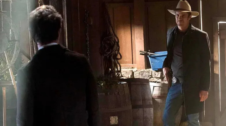 Marshal Raylan Givens confronts Boyd Crowder (seen from behind) on Justified (2010-2015)