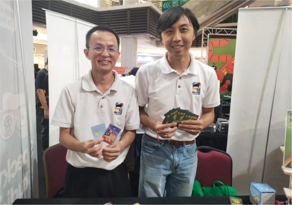 Buddhima Tham and Leong Qing Ye from R&D showcasing their locally developed titles, Durian Runtuh and The Malaysian Holiday Card Game at All Aboard 2026. — Picture by Ian Jeremiah Patrick