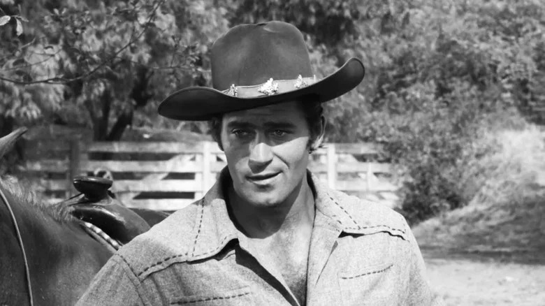 Clint Walker's Cheyenne Bodie is seen in closeup as he stands outside in Cheyenne