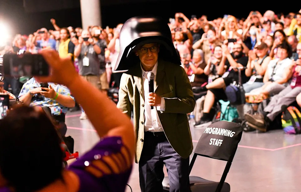 Chris Delmas/AFP via Getty Images - PHOTO: Canadian actor Rick Moranis wears his Lord Dark Helmet costume as he attends "Spaceballs: The New One" panel during Comic Con International in San Diego, on July 24, 2026.