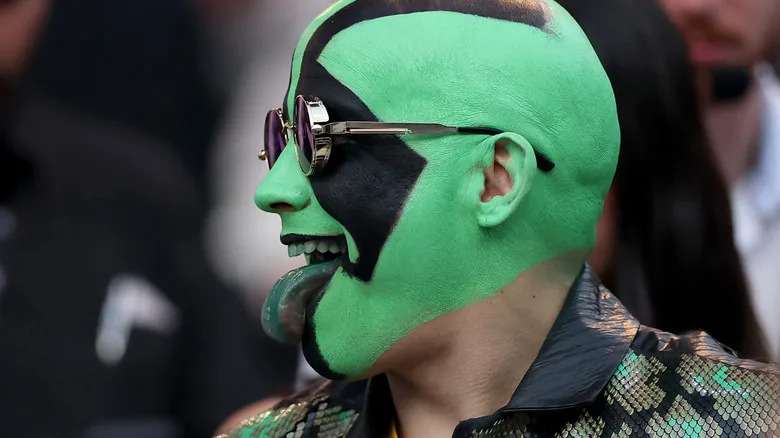 Mr. Igauan wearing green and black face paint