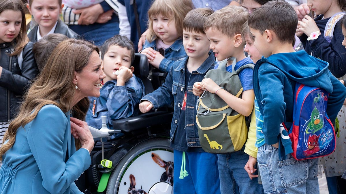 Catherine, Princess of Wales speaks with children at Town Hall in Reggio Emilia.