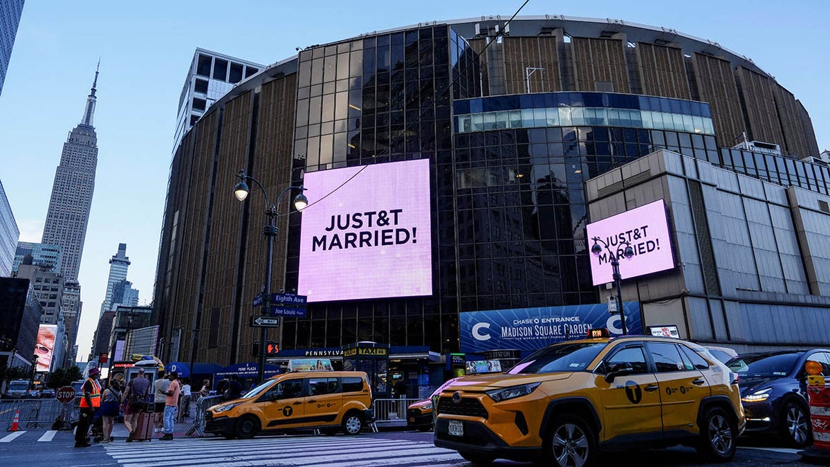 A sign reads "JUST&T MARRIED!" outside Madison Square Garden
