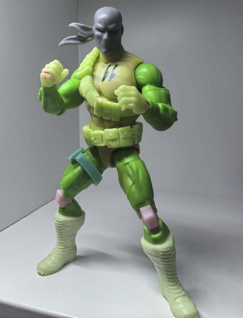 Factory test shot prototype of the Mattel Deathstroke action figure in unpainted plastic