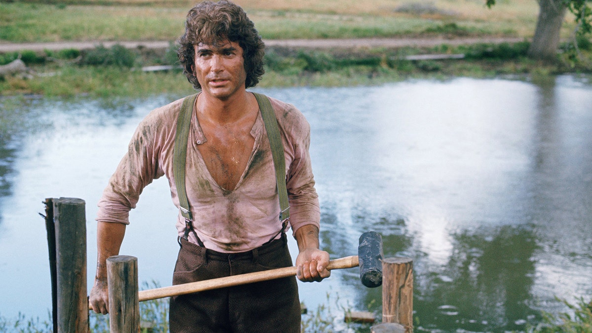 Michael Landon with his shirt half open.