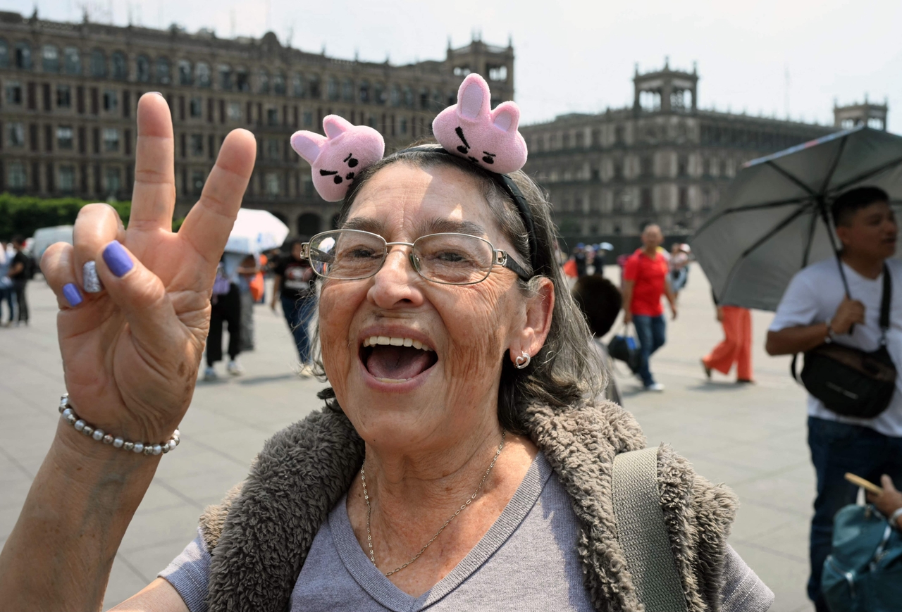 A fan wears a headband with BT21 character Cooky — a character created to resemble member Jungkook — during BTS' visit to the National Palace in Mexico City in May. (AFP)
